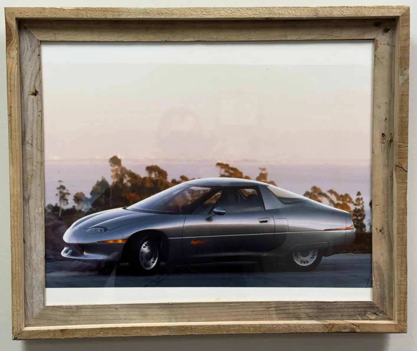 1 of 2 Real Photo taken of the 1990 General Motors Impact concept car, which later went into production as the GM EV1, the first modern mass-produced electric vehicle from a major American automaker.