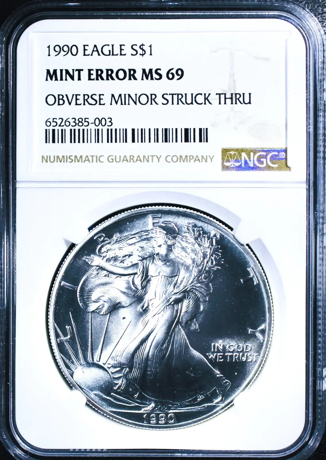 1990 American Silver Eagle MS69 NGC – Obverse Struck-Through Error, Rare Mint Anomaly Heritage Pastime