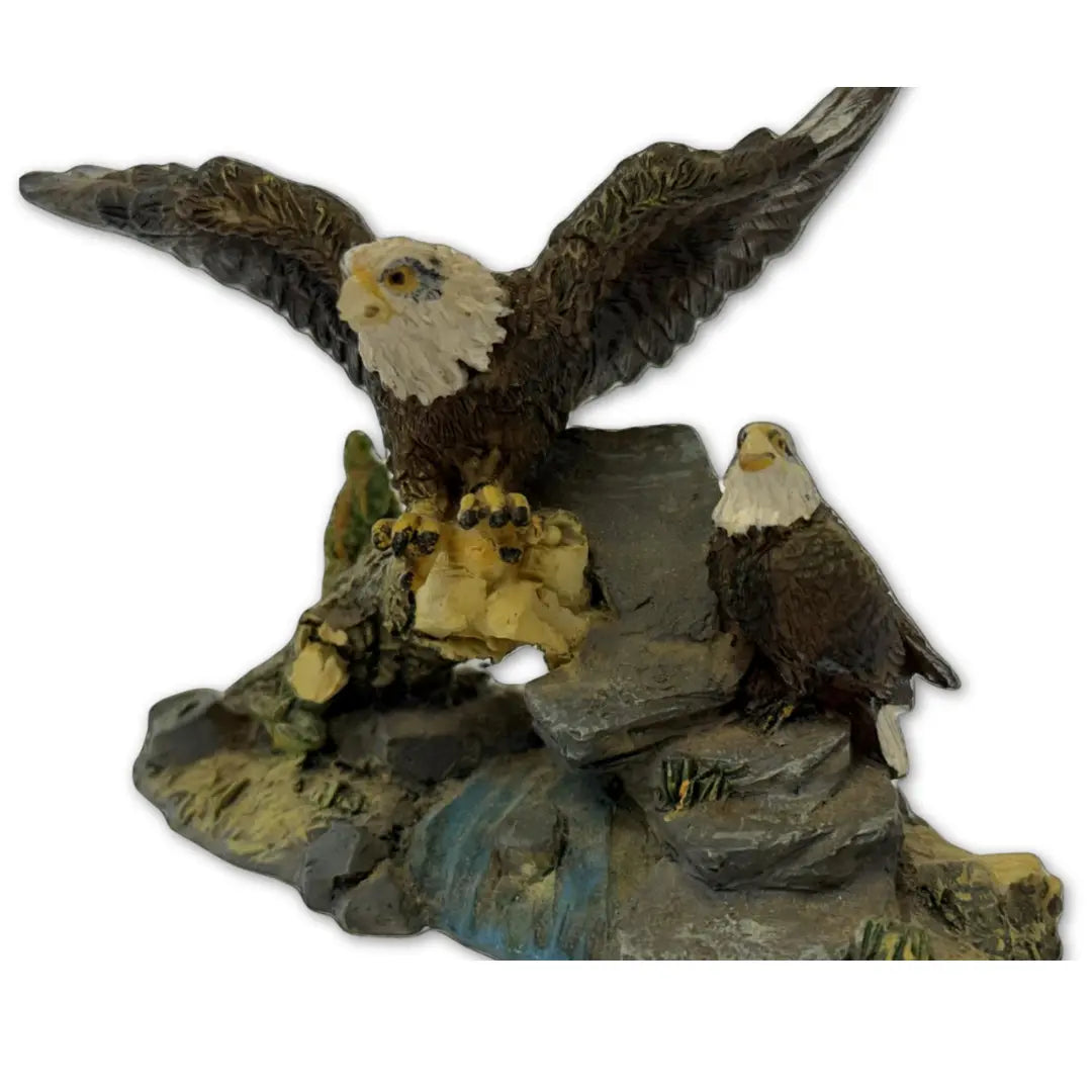Sculpture features two bald eagles perched on a rock and branch formation Heritage Pastime