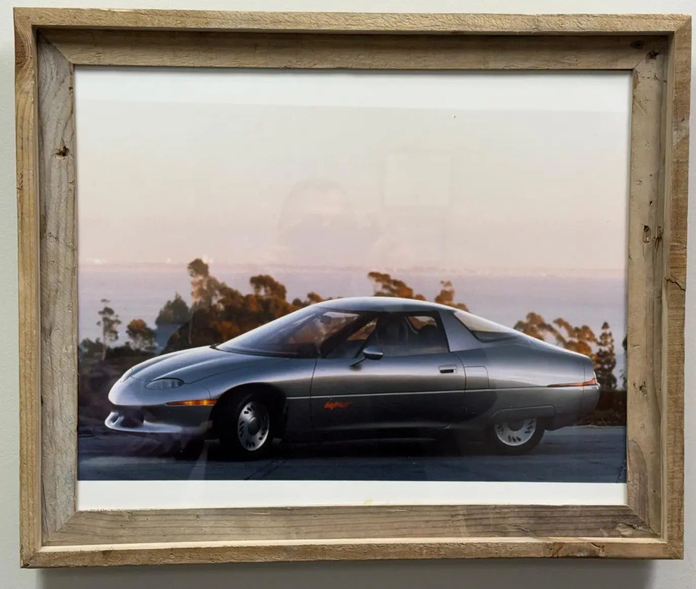 1 of 2 Real Photo taken of the 1990 General Motors Impact concept car, which later went into production as the GM EV1, the first modern mass-produced electric vehicle from a major American automaker.