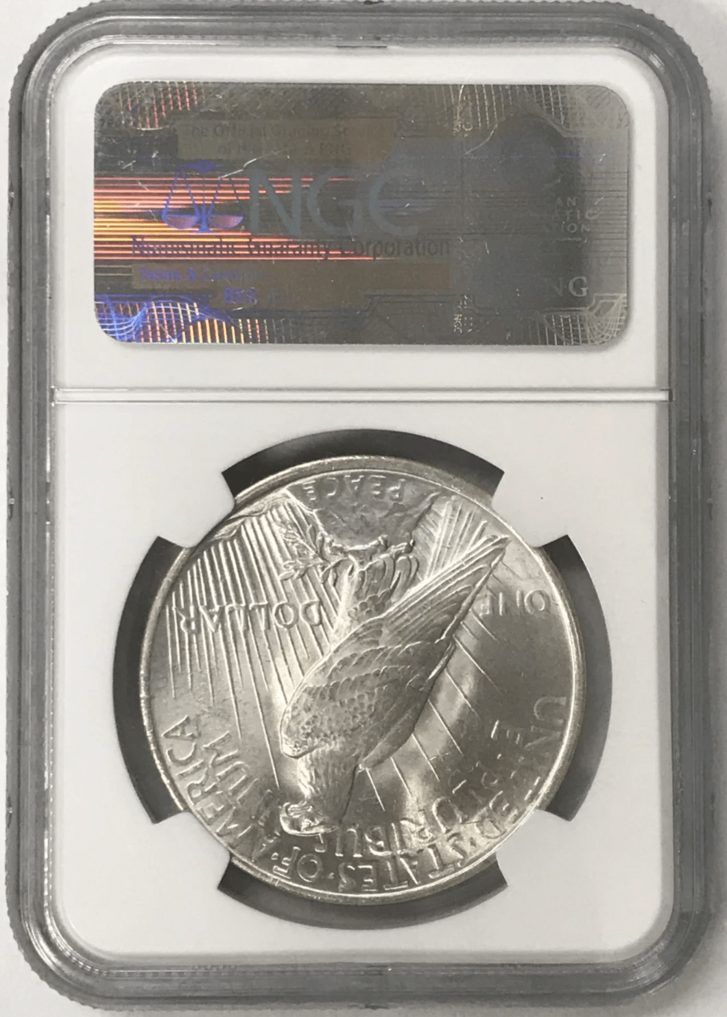 1923 Silver Peace Dollar reverse with heraldic eagle in NGC MS63 slab