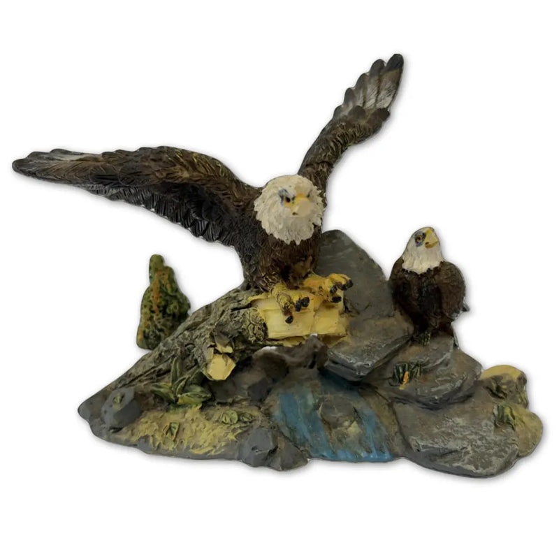 Sculpture features two bald eagles perched on a rock and branch formation Heritage Pastime